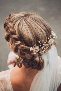 Braided updo styled with small hair pins